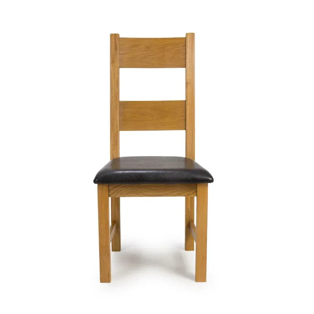 Oak dining chair with ladder back and black padded seat, front view