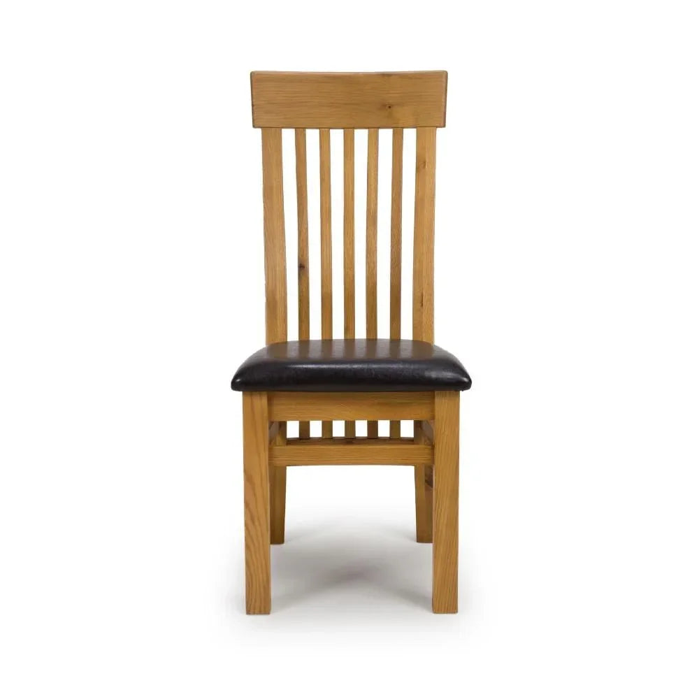 Oak dining chair with dark cushioned seat and slatted backrest, front view