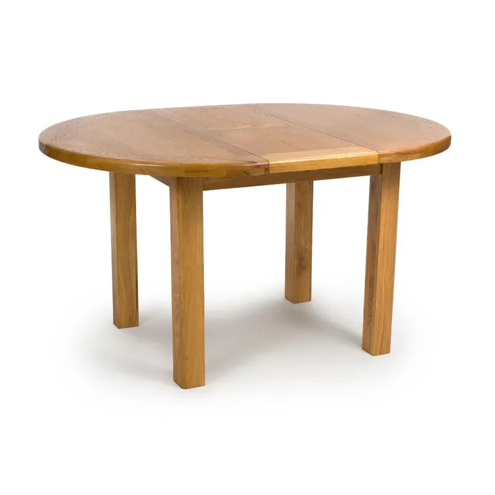 Oval oak dining table with extendable leaf and four sturdy wooden legs