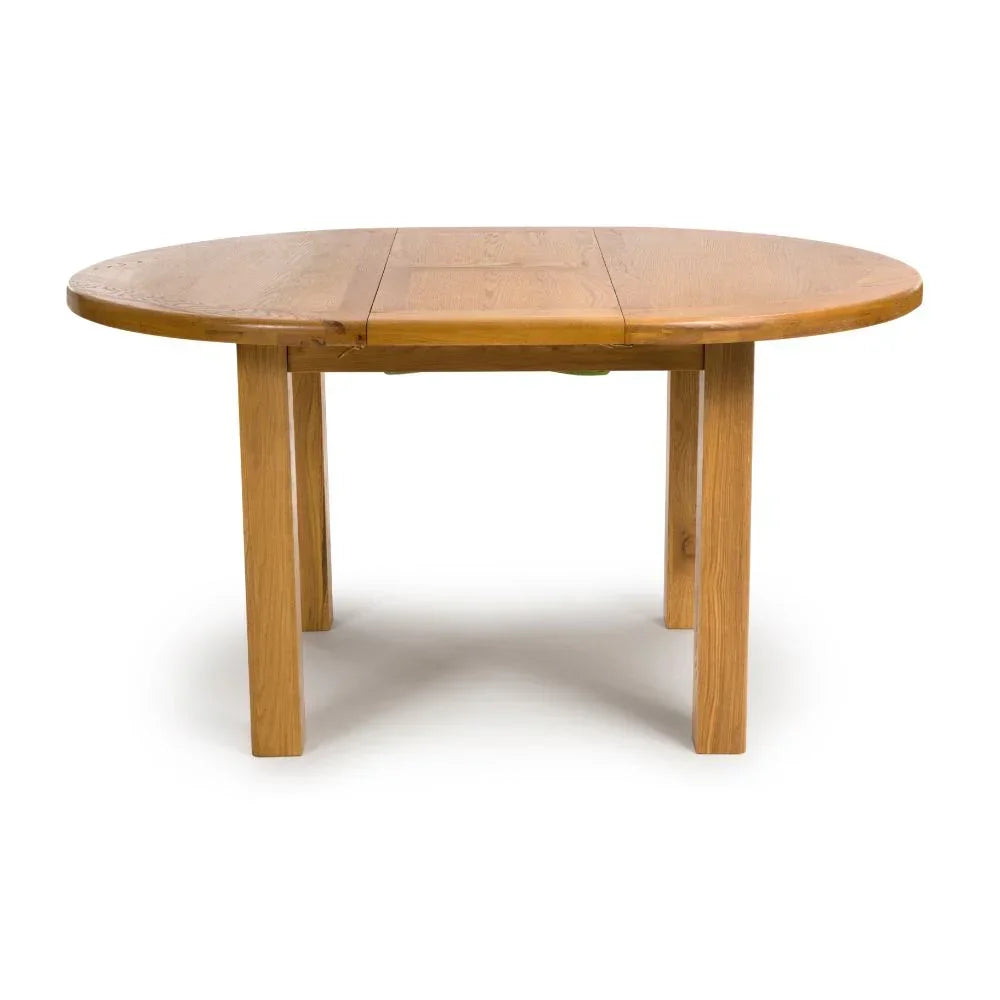 Oak extending dining table with rounded edges and four straight legs, front view