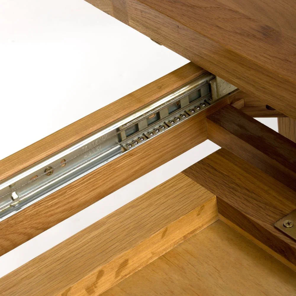 Oak extending dining table metal glide rail detail closeup