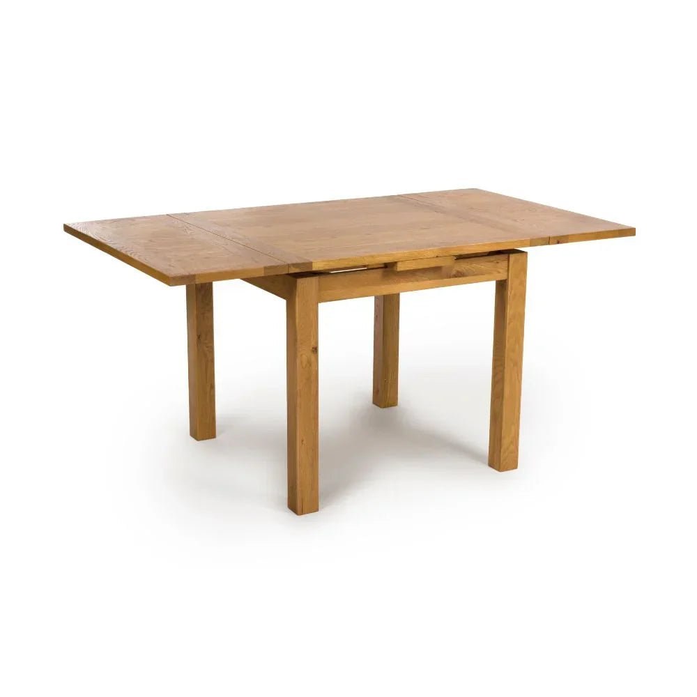 Rectangular oak extendable dining table with drop leaf ends, shown on white background