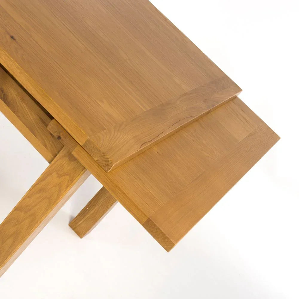 Oak extending dining table with slide-out leaf and natural wood grain finish