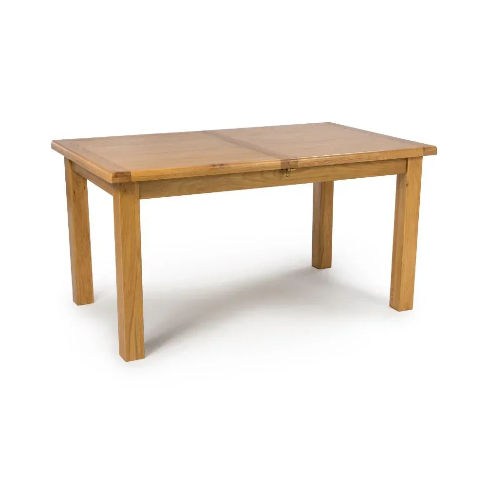 Rectangular oak dining table with four sturdy legs on white background