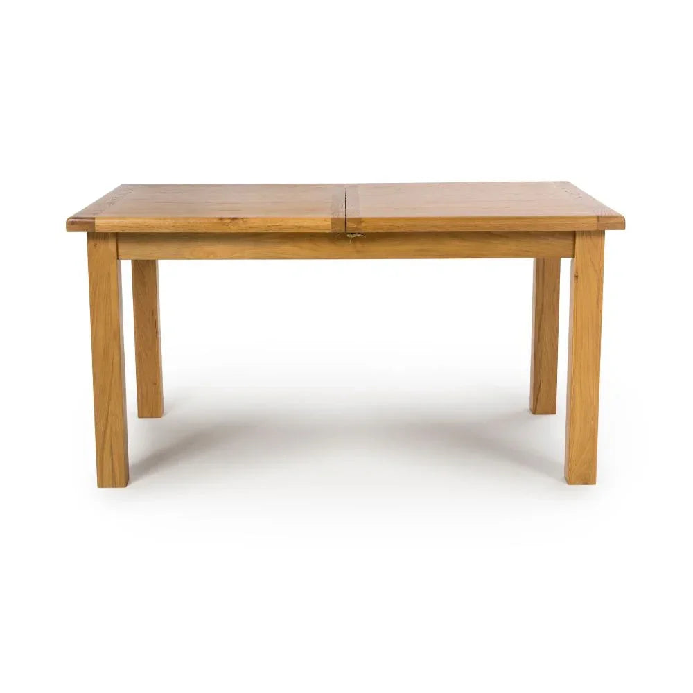 Rectangular oak dining table with four sturdy legs on white background