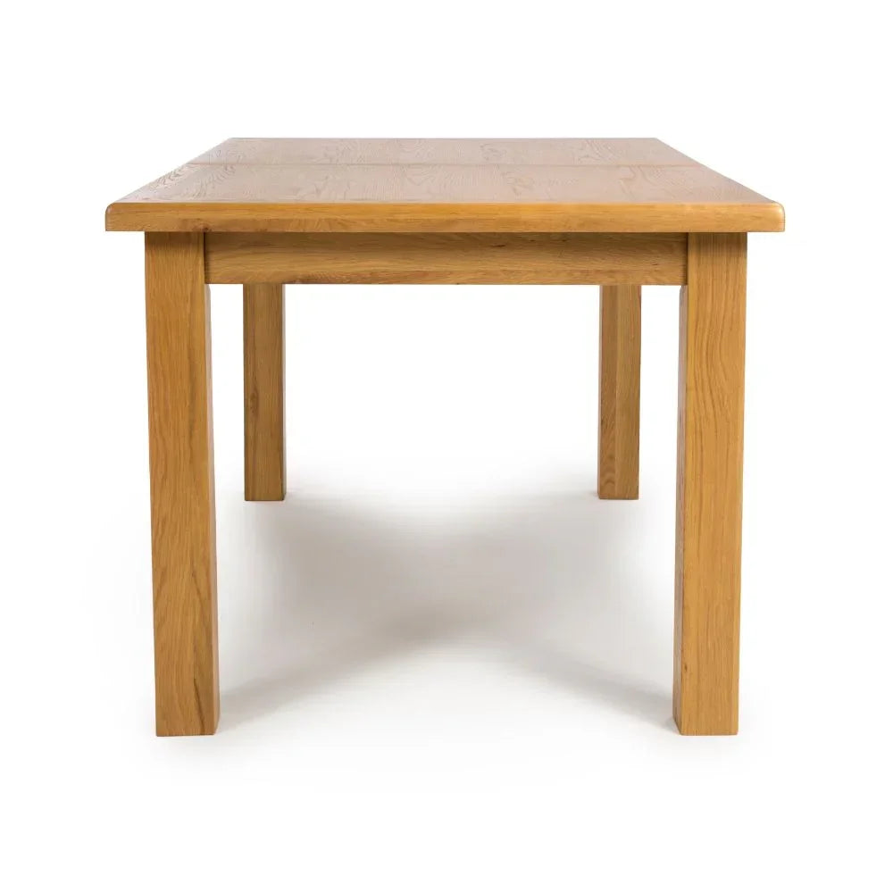 Rectangular oak dining table with four sturdy legs, front angle view