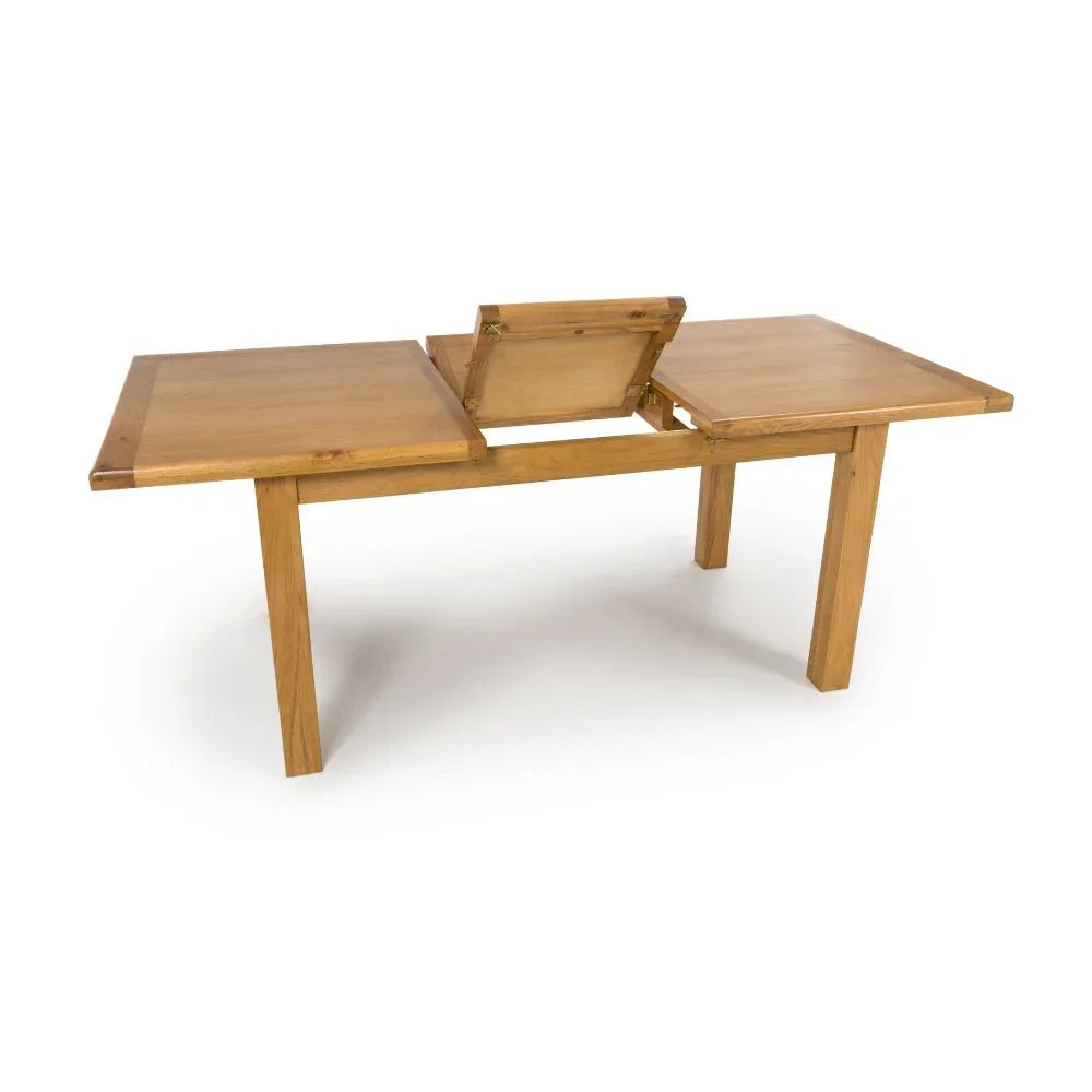 Oak extendable dining table with folding leaf mechanism, shown partially extended
