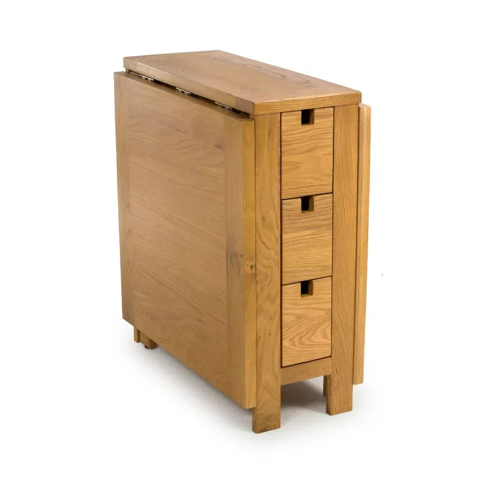 oak folding dining table with three storage drawers, shown closed from side angle