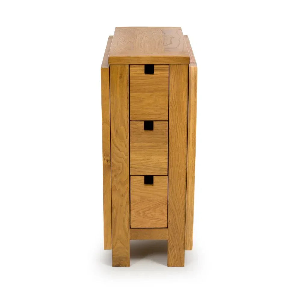 Oak chest of drawers side view showing three drawers with cut-out handles