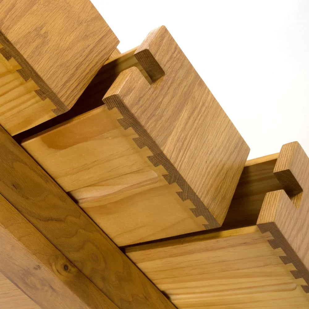Close-up of wooden furniture dovetail joint showing craftsmanship and natural wood grain