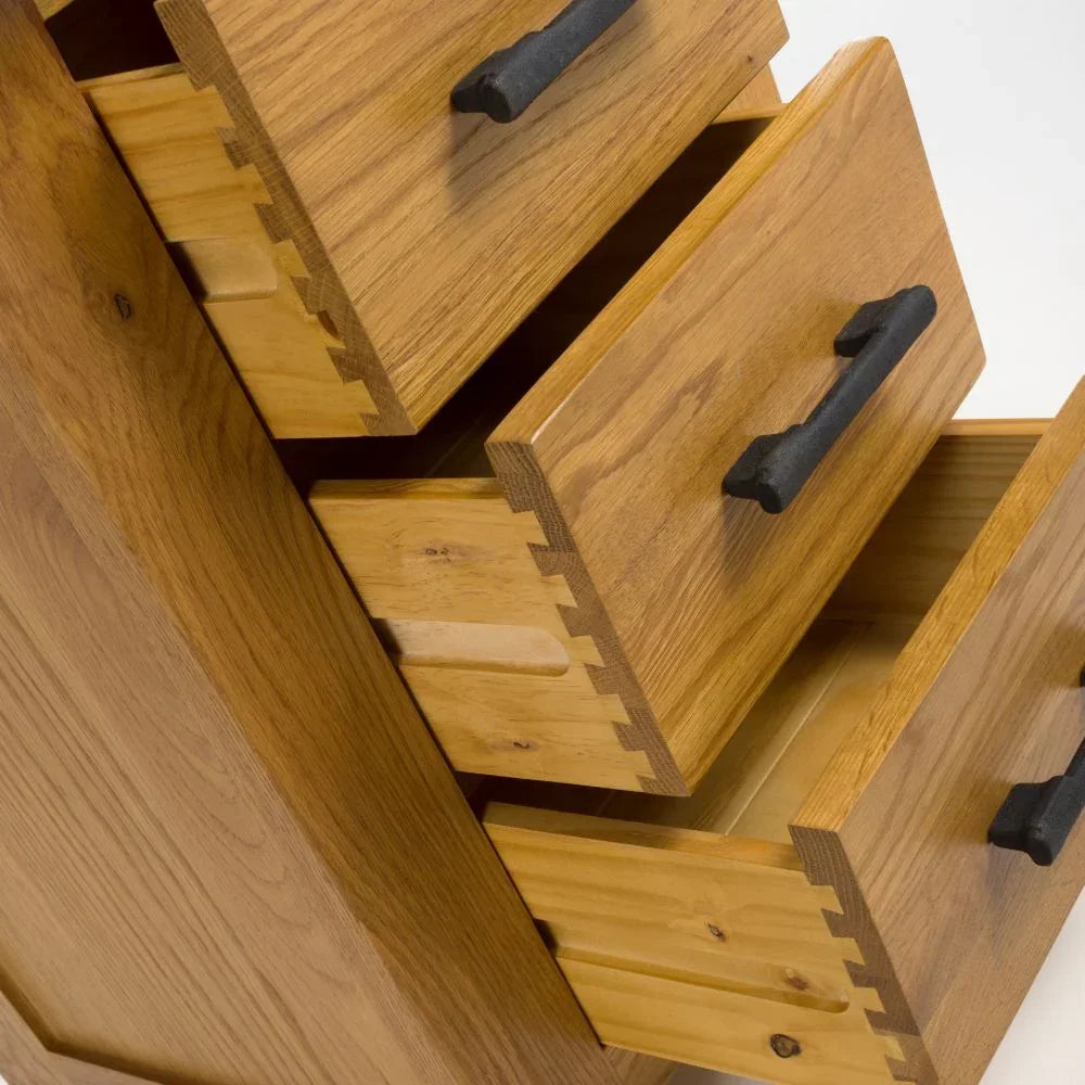 Oak chest of drawers with black metal handles and dovetail joints