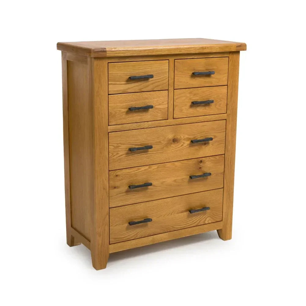 Oak chest of drawers with black metal handles and natural wood grain finish