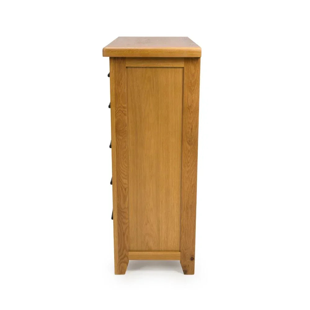 Oak chest of drawers side view showing wood grain and panel detailing