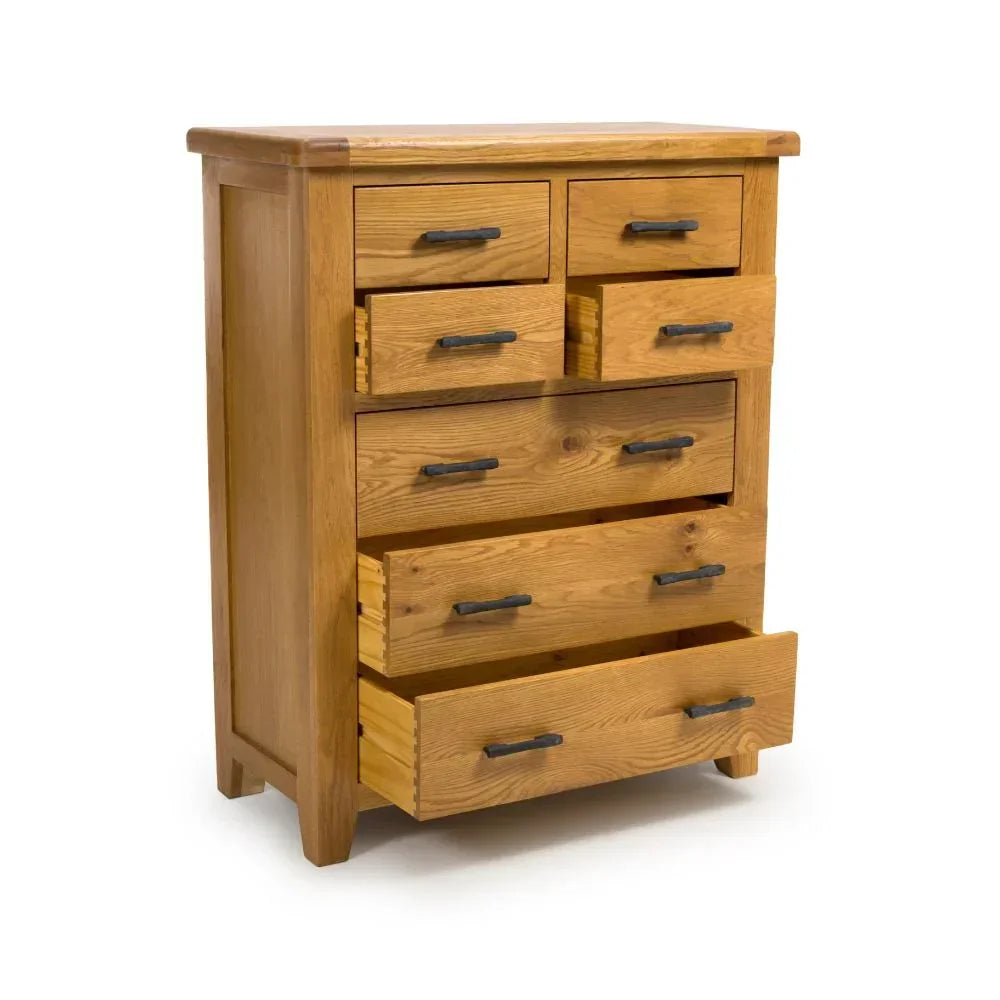 Oak chest of drawers with metal handles, several drawers open, angled front view