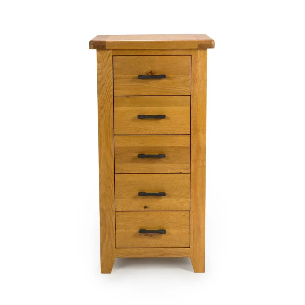 Tall oak chest of drawers with five drawers and black handles on white background