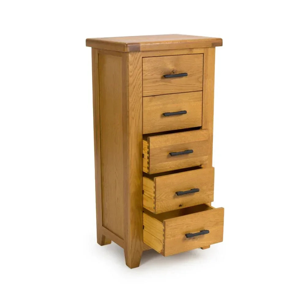 Tall oak chest of drawers with five drawers and black metal handles
