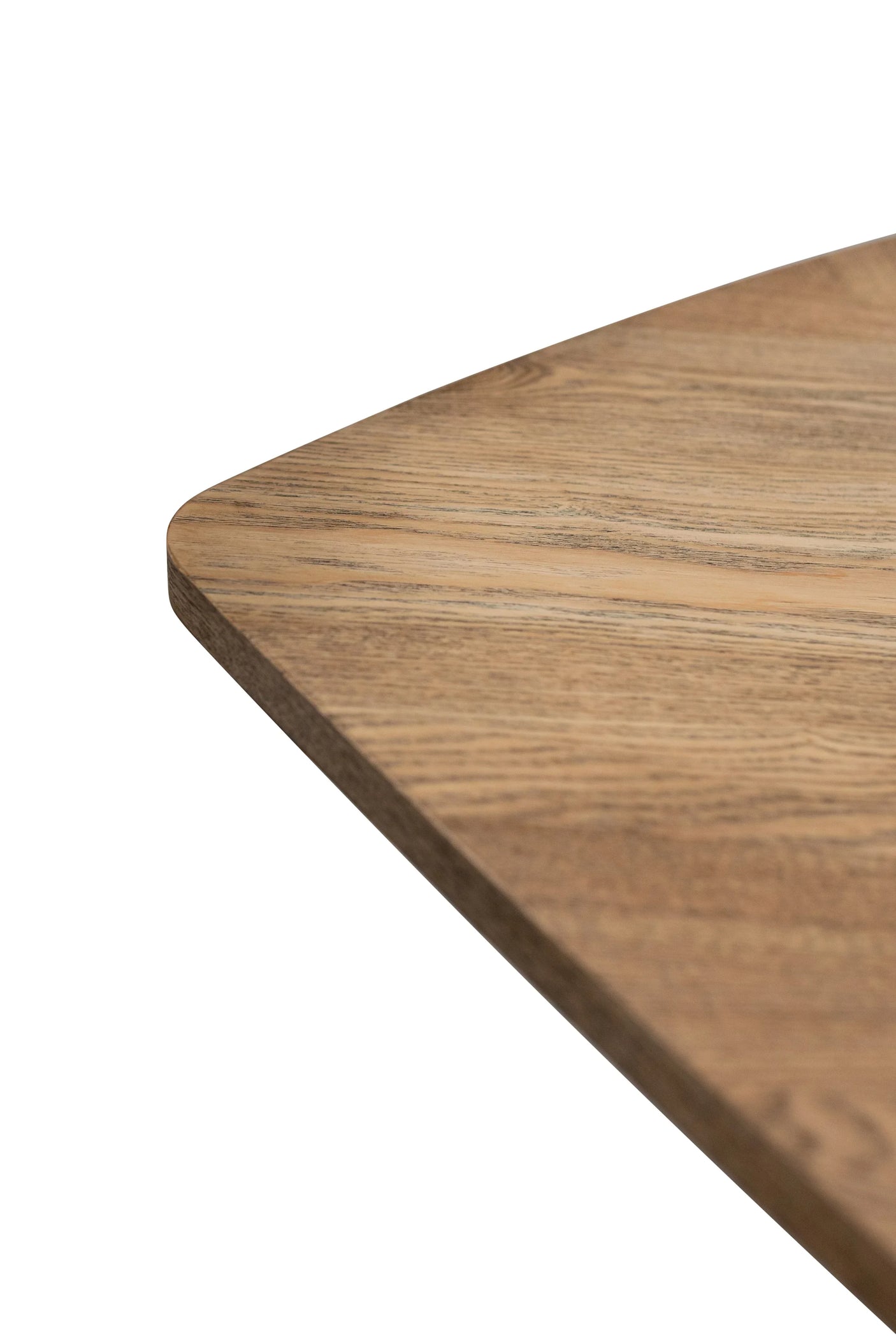 Closeup of oak dining table top with rounded edge and natural wood grain finish