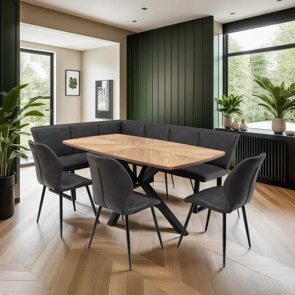 Rectangular oak dining table with black metal legs, charcoal corner bench and matching chairs