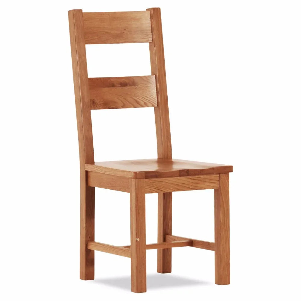 Solid wood dining chair with slatted back and natural oak finish, front side view