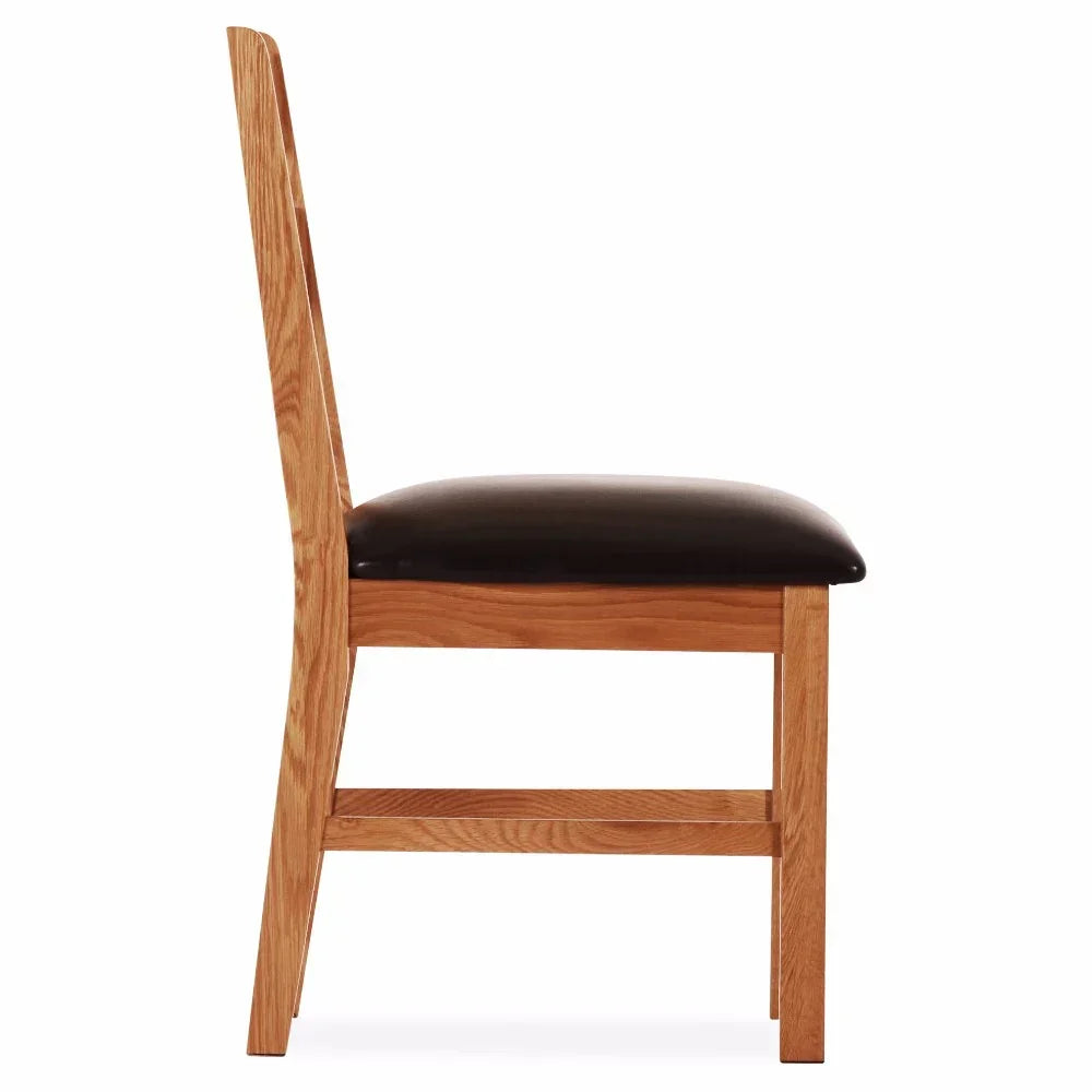 Side view of wooden dining chair with brown leather seat and high backrest