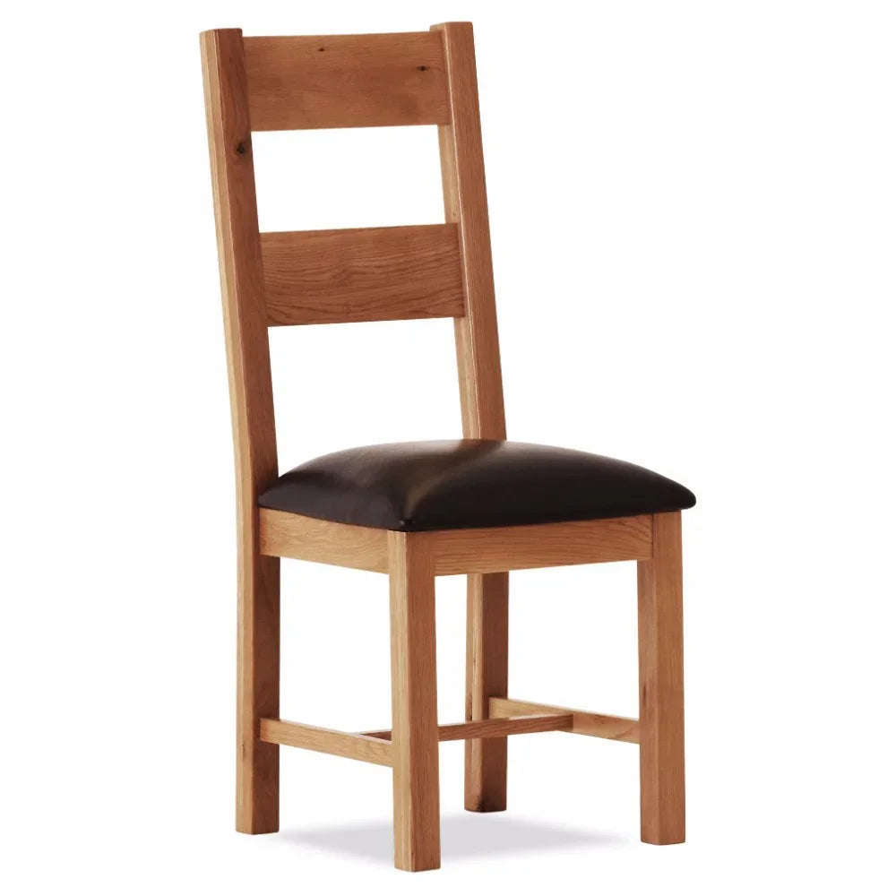 Oak dining chair with ladder back and brown leather seat, angled front view