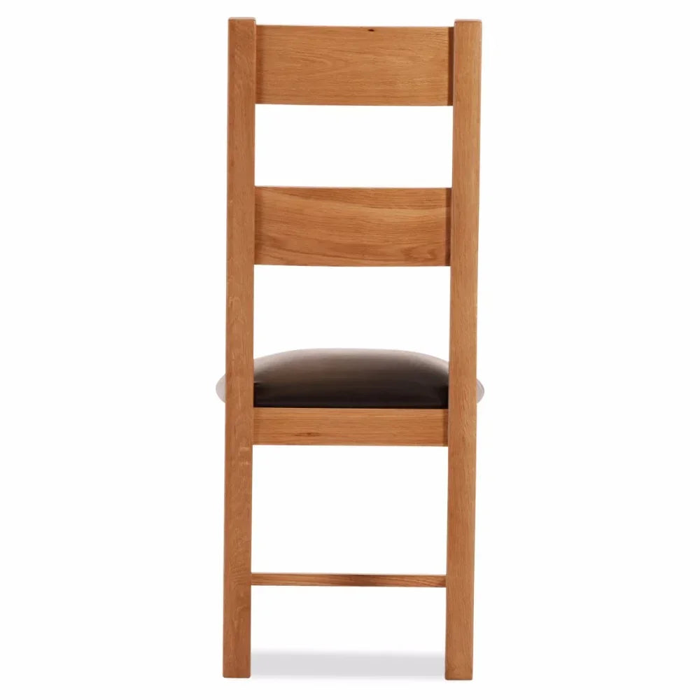 Oak dining chair with slatted back and black padded seat, rear view