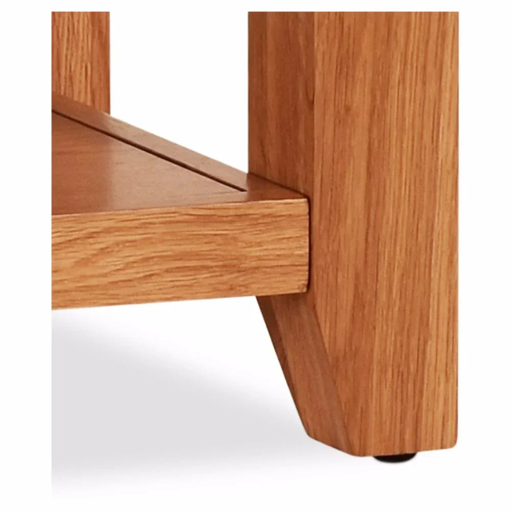 Close-up of oak coffee table leg and shelf with natural wood grain detail