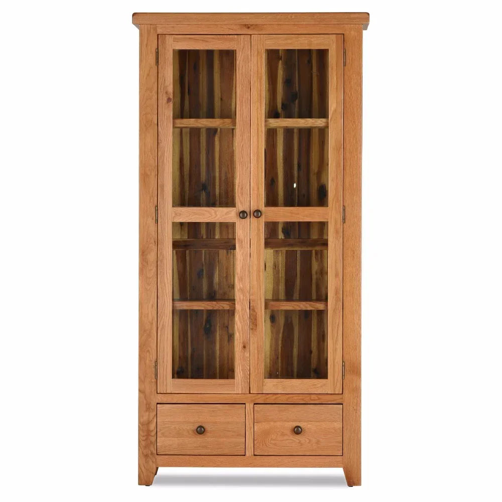 Oak display cabinet with glass doors, shelves, and two lower storage drawers