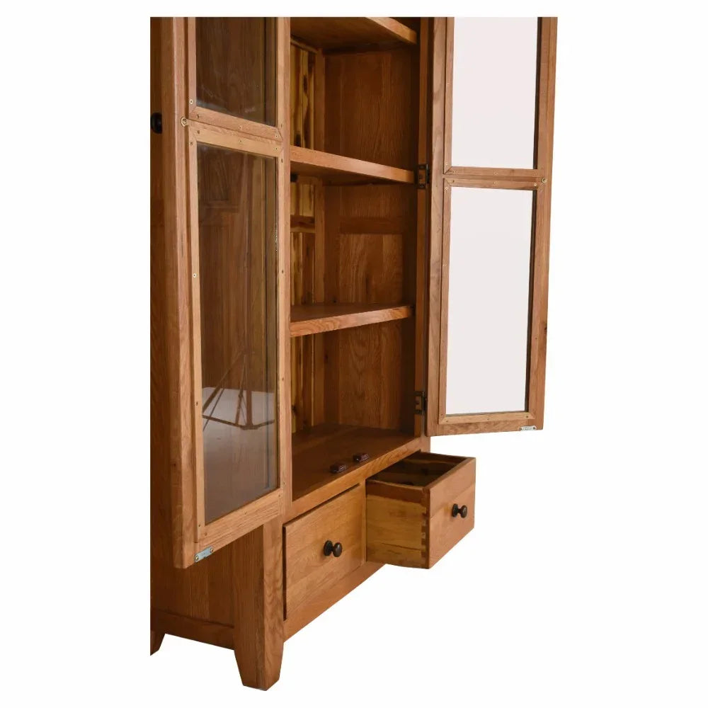 Oak display cabinet with glass doors, open shelves, and lower storage drawers