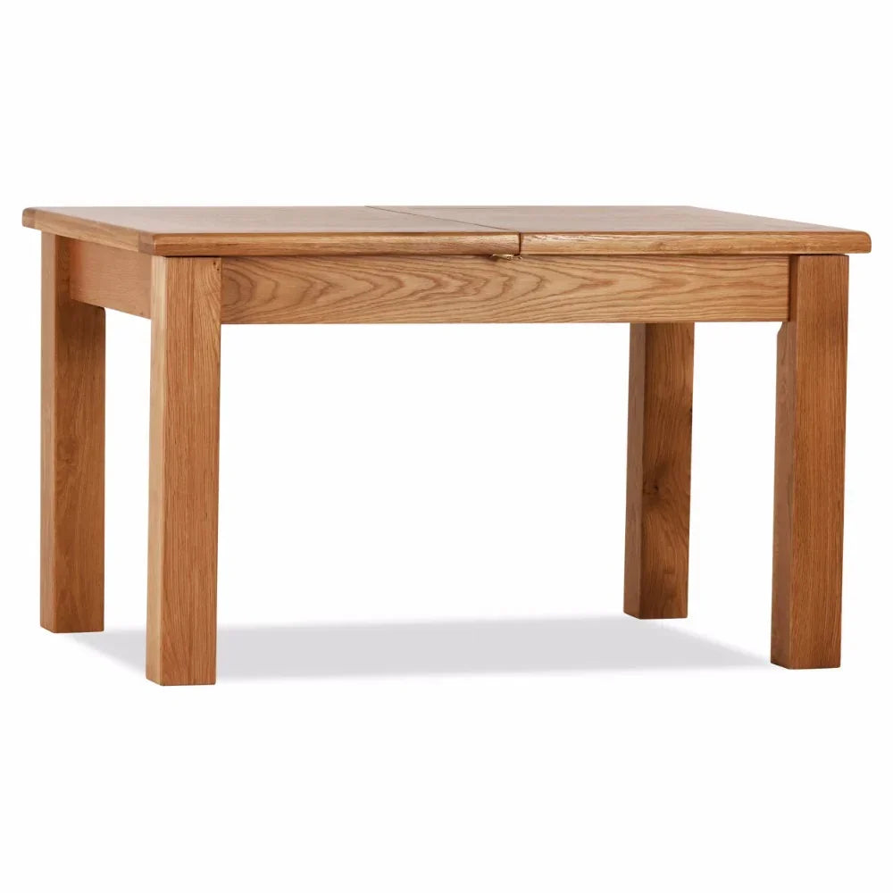 Rectangular oak dining table with extension leaf and chunky legs, photographed front view