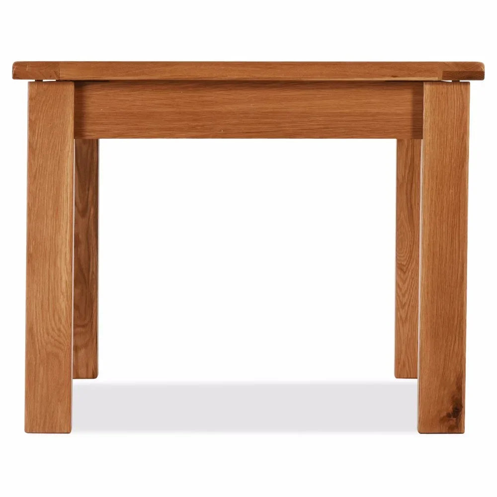 Solid oak dining table with rectangular top and sturdy legs, front view