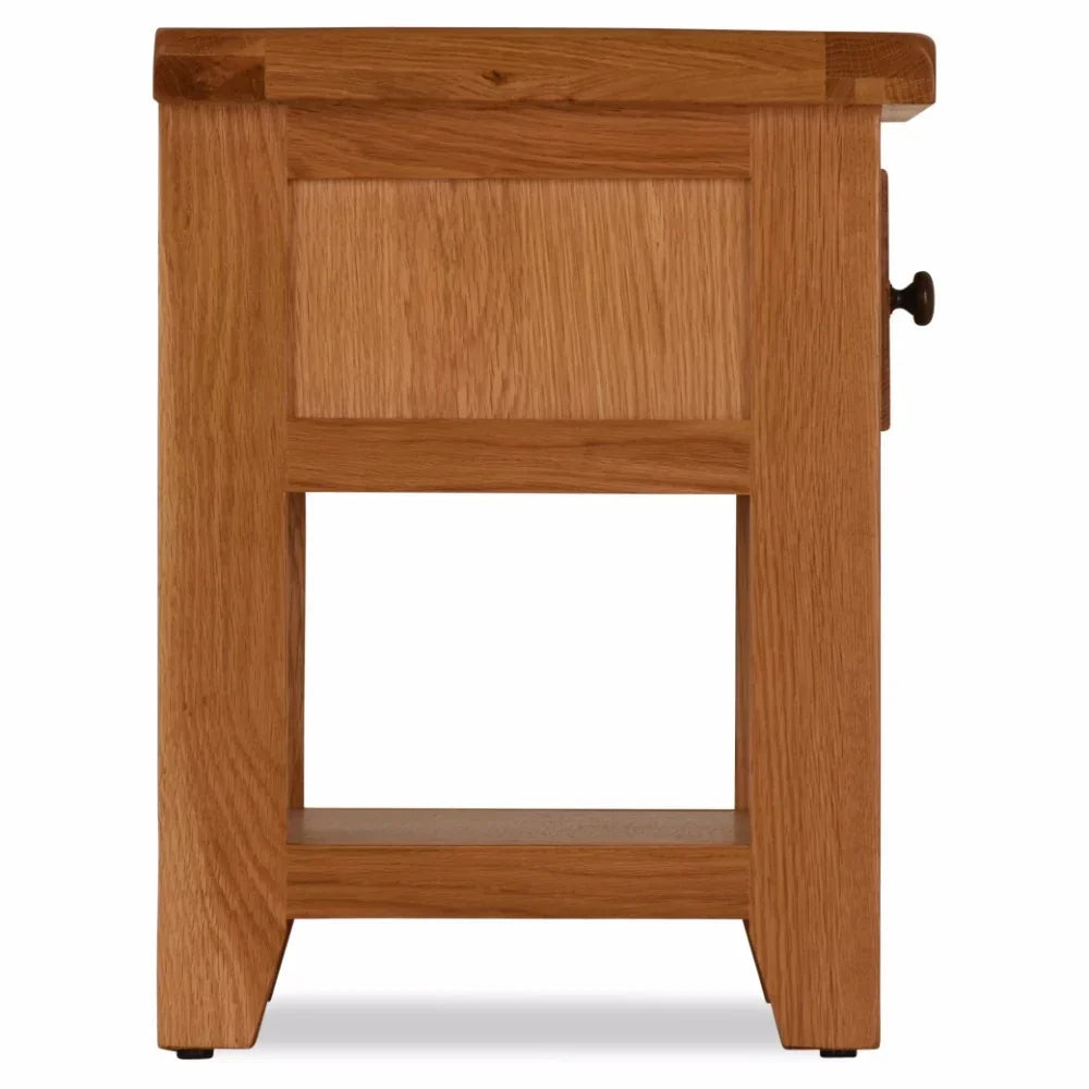 Solid oak lamp table side view with panel detail, lower shelf and metal drawer handle