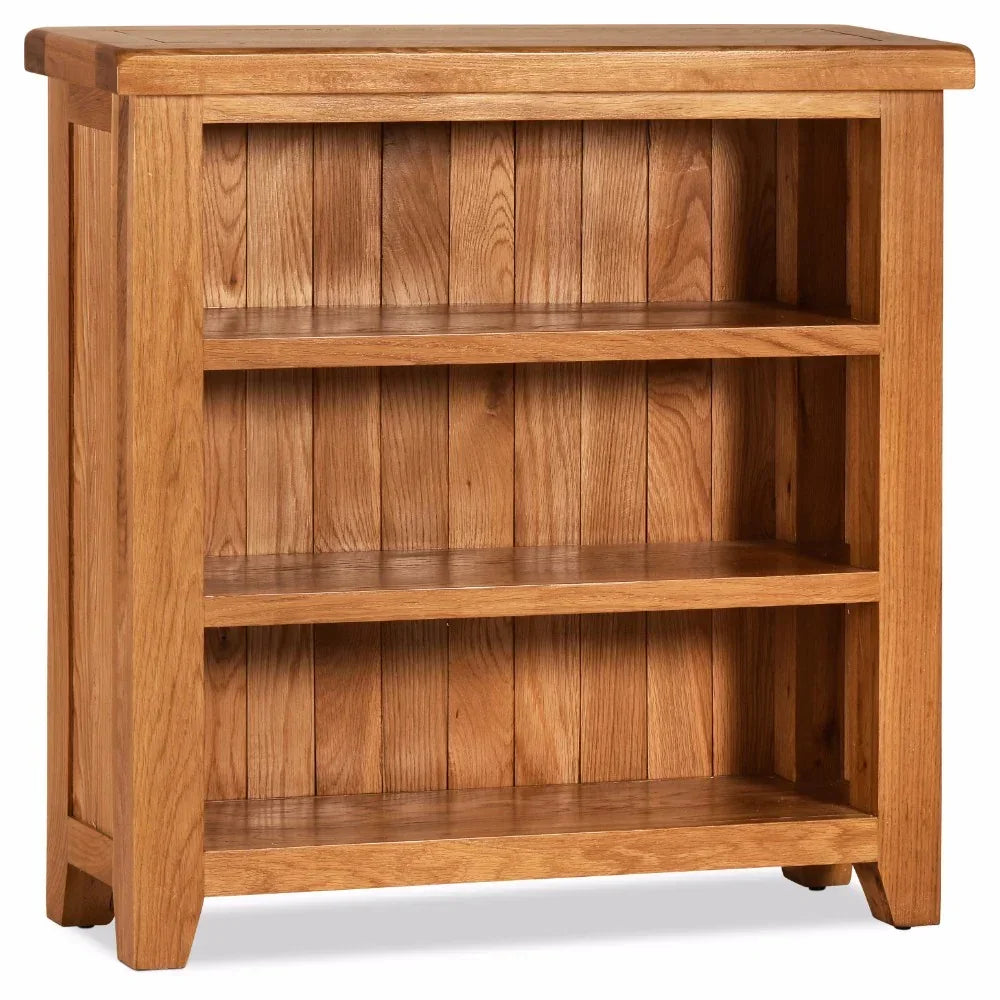 Oak bookcase with three open shelves and paneled wood back