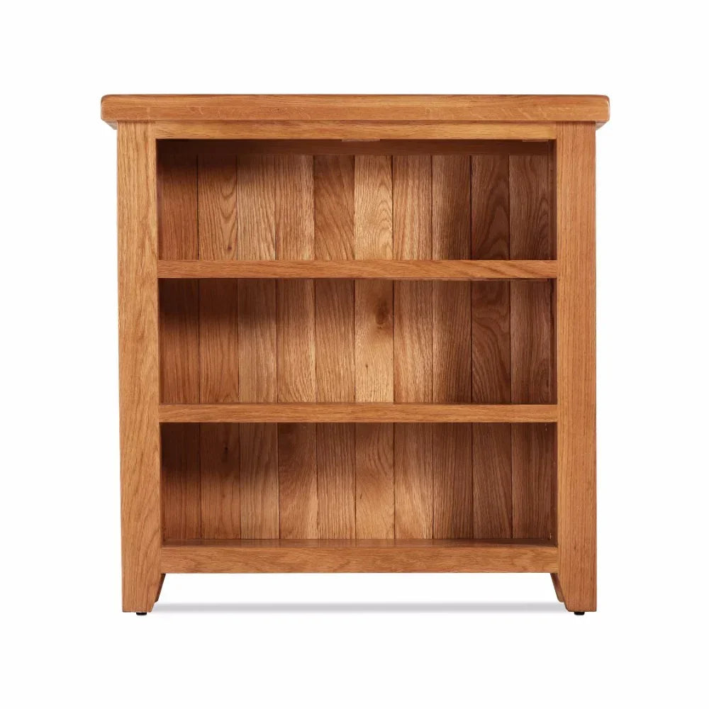 Oak bookcase with three shelves and wood panel back, front facing view