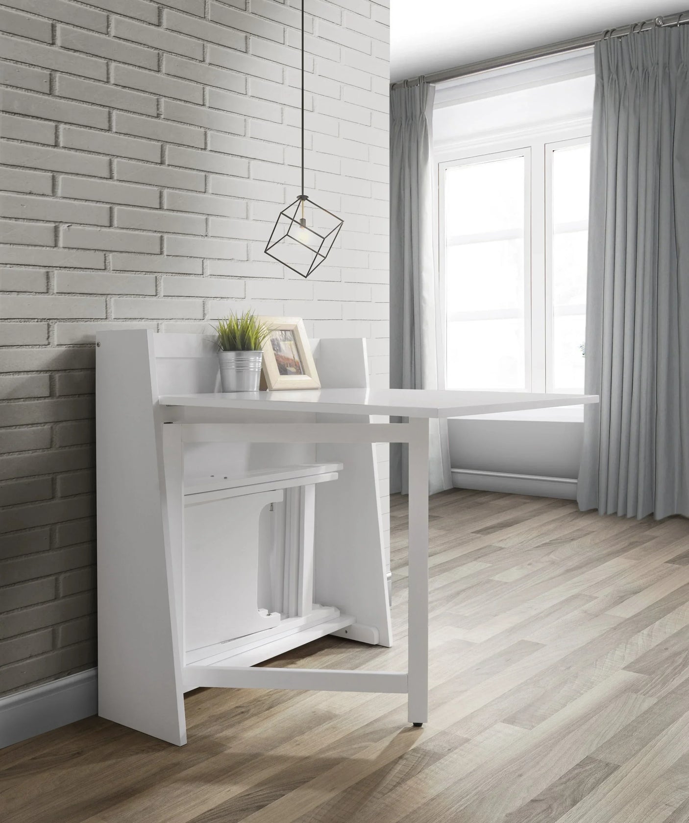 White folding dining set with compact design against brick wall, modern light fixture above