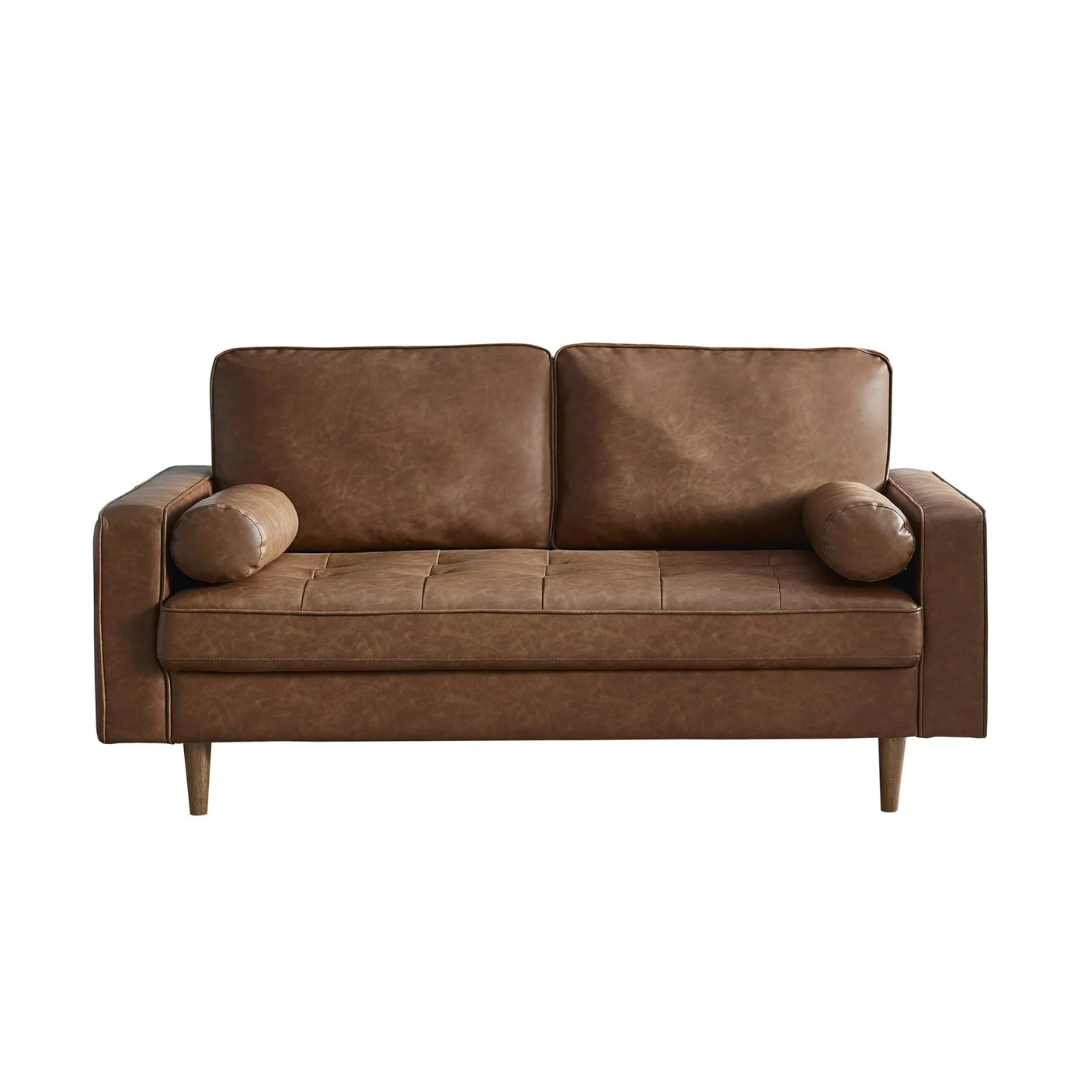 Brown leather sofa with wooden legs and two matching bolster cushions, front view