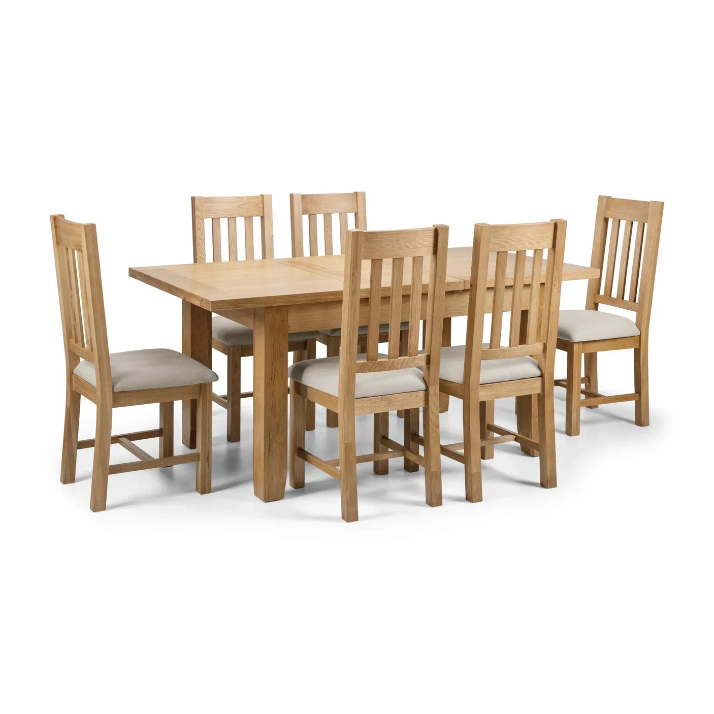 Oak dining table with six slatted back chairs and upholstered seats on white background