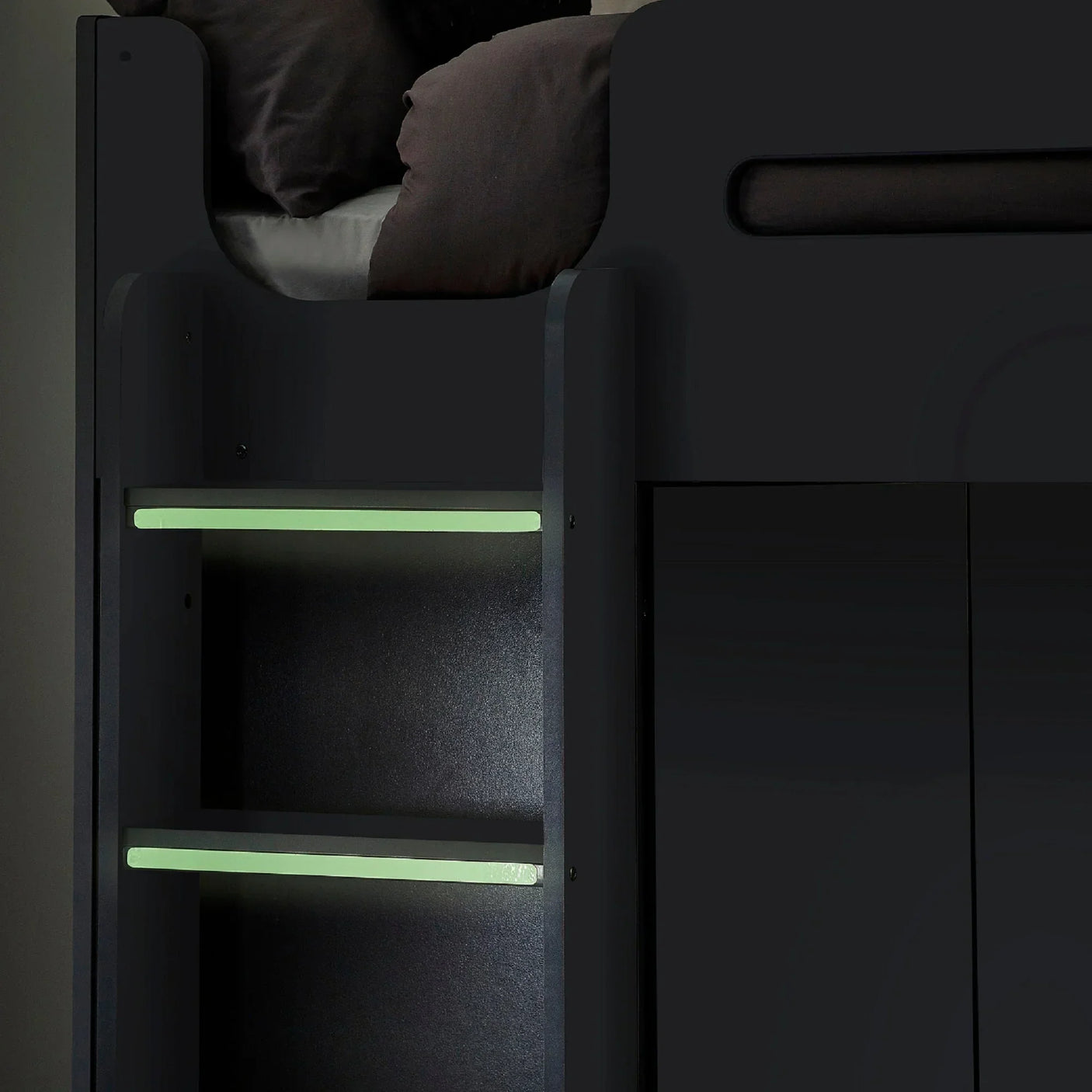 Anthracite highsleeper bed with glowing ladder rungs and black bedding detail