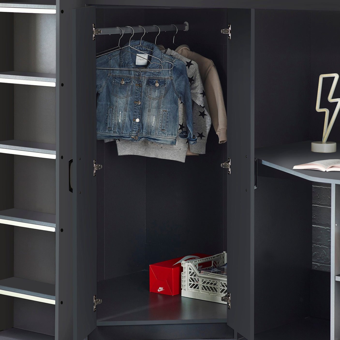 Black wardrobe with open doors, clothes rail, shelves, and storage box on lower shelf