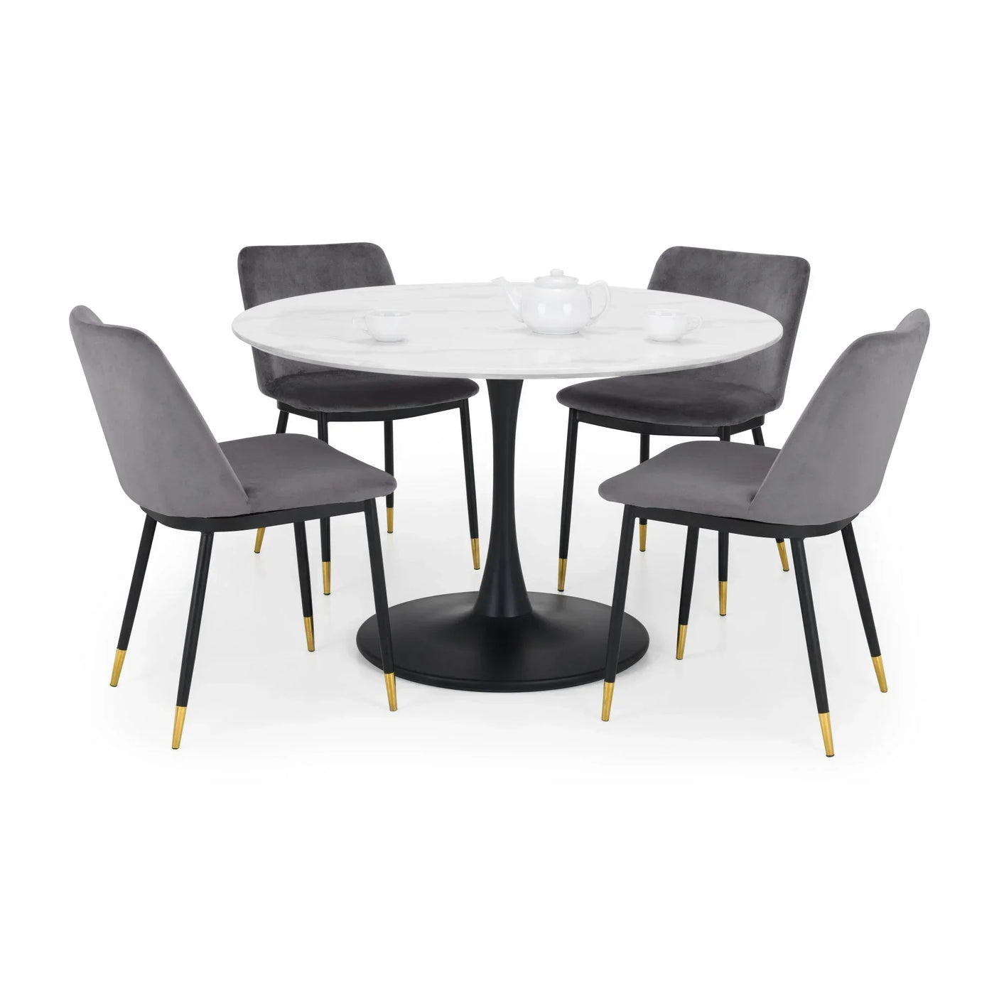 Round marble dining table with black pedestal base and four grey velvet dining chairs