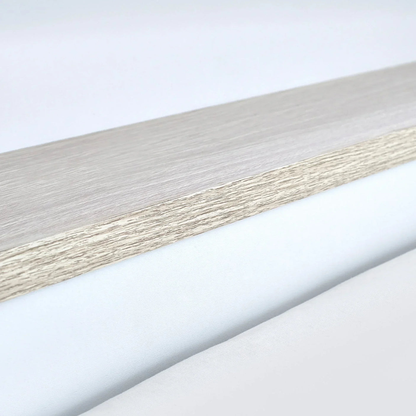 Pale wood bunk bed frame detail with visible grain and light finish