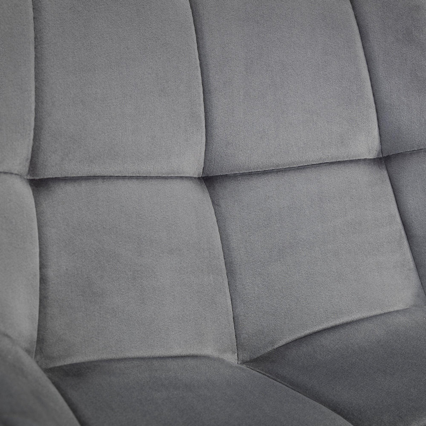 Close up of grey fabric chair upholstery with square stitched detail