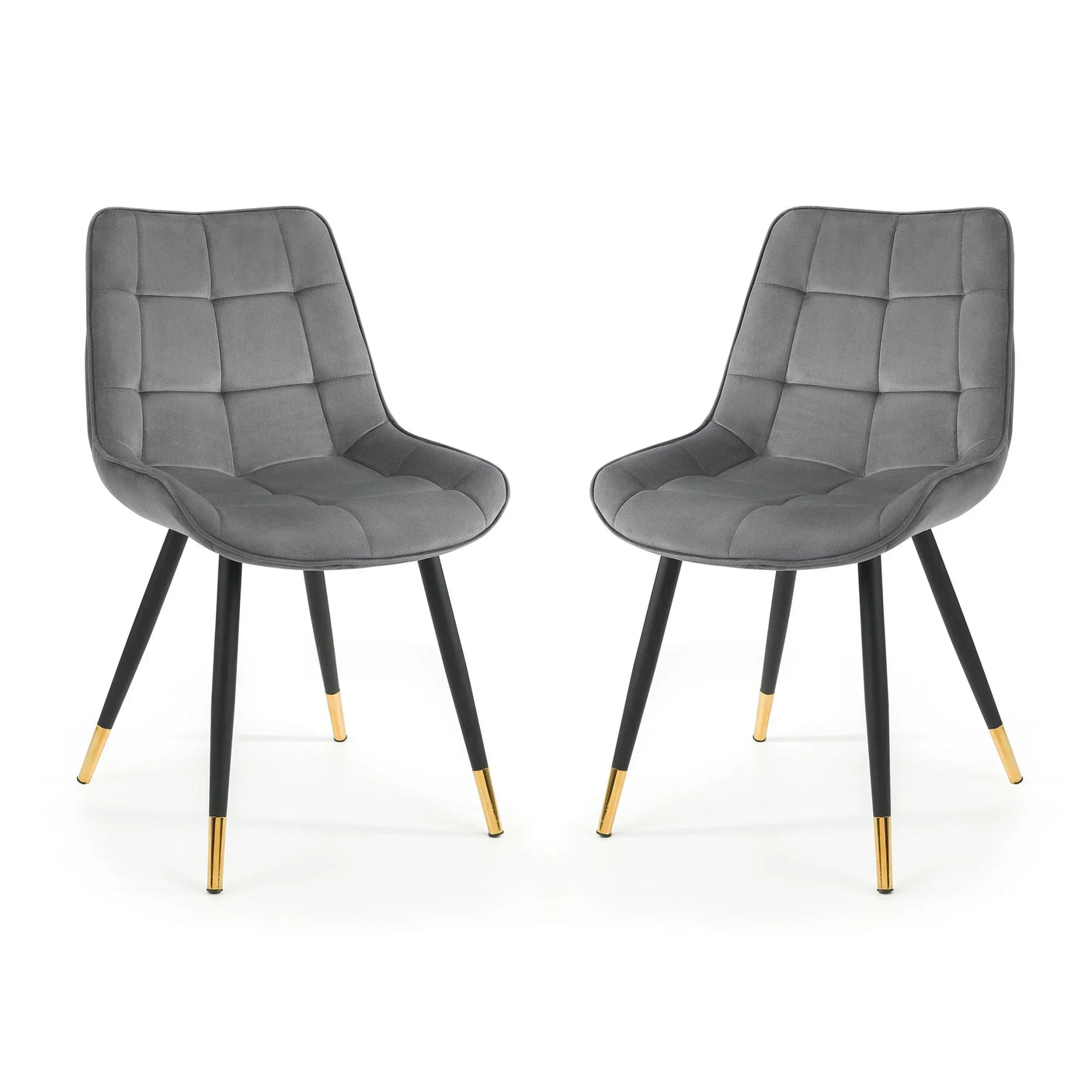 Set of two grey dining chairs with quilted seats and black legs featuring gold tips