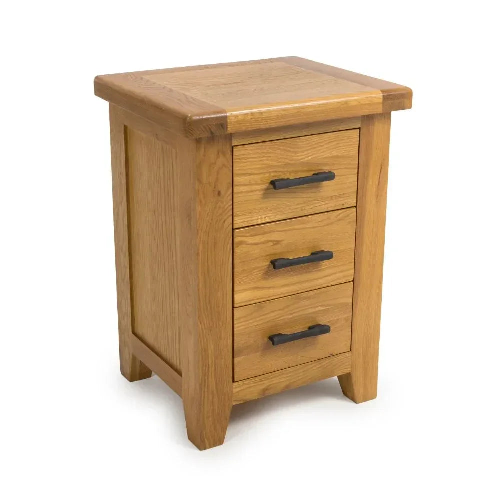 Oak bedside table with three drawers and black metal handles