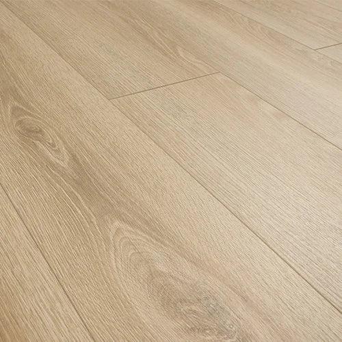 Honey oak laminate flooring with natural grain detail and matt finish