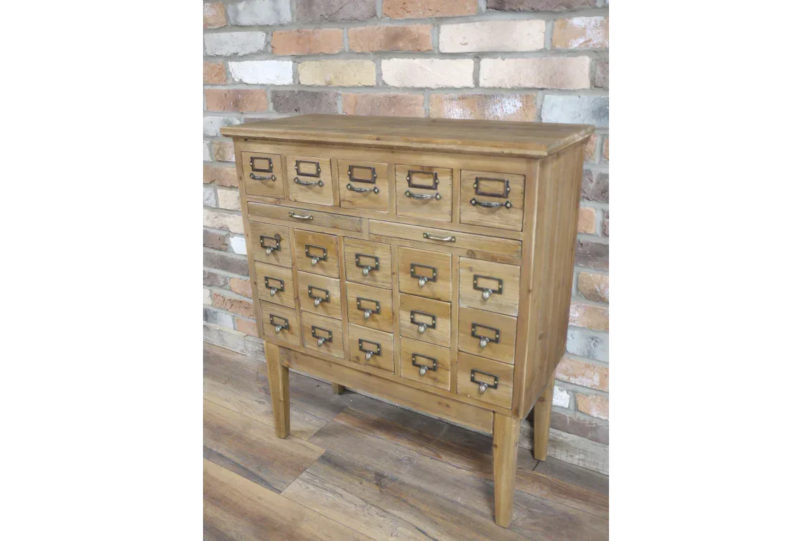 Rustic wooden storage cabinet with multiple drawers and metal handles against brick wall