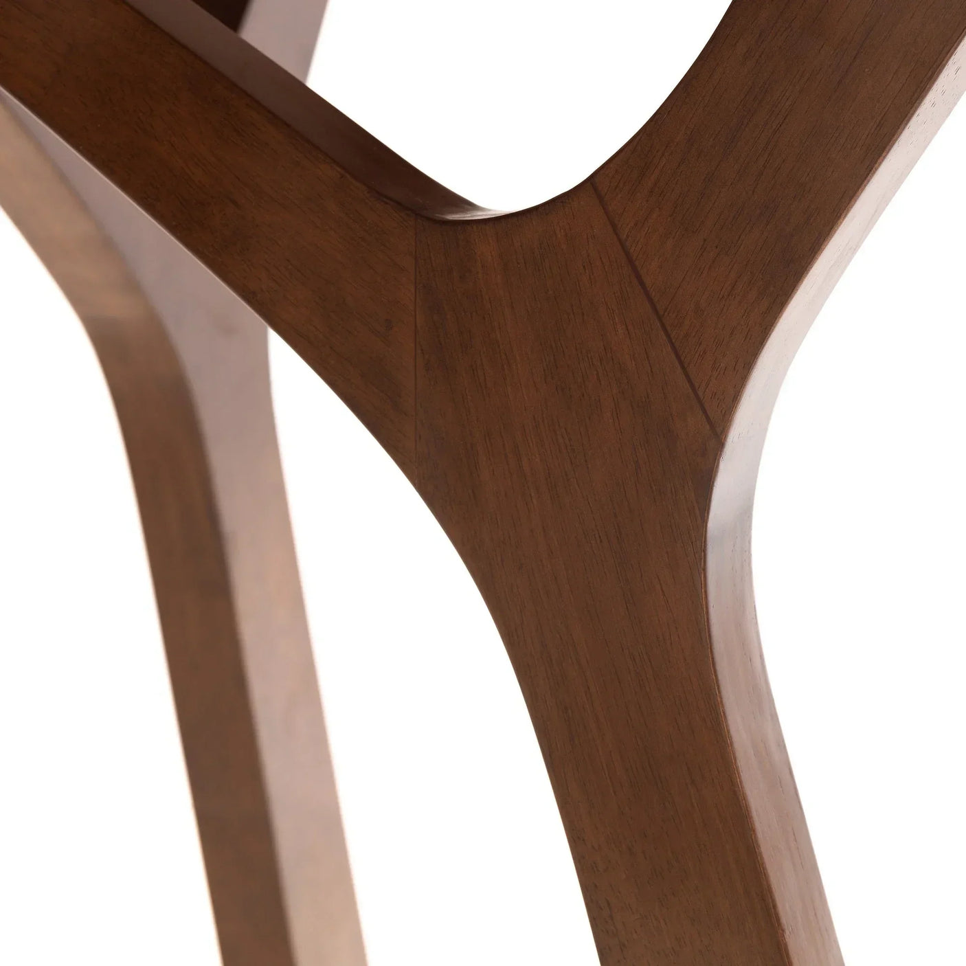 Solid wood dining table leg with curved joinery detail and smooth walnut finish
