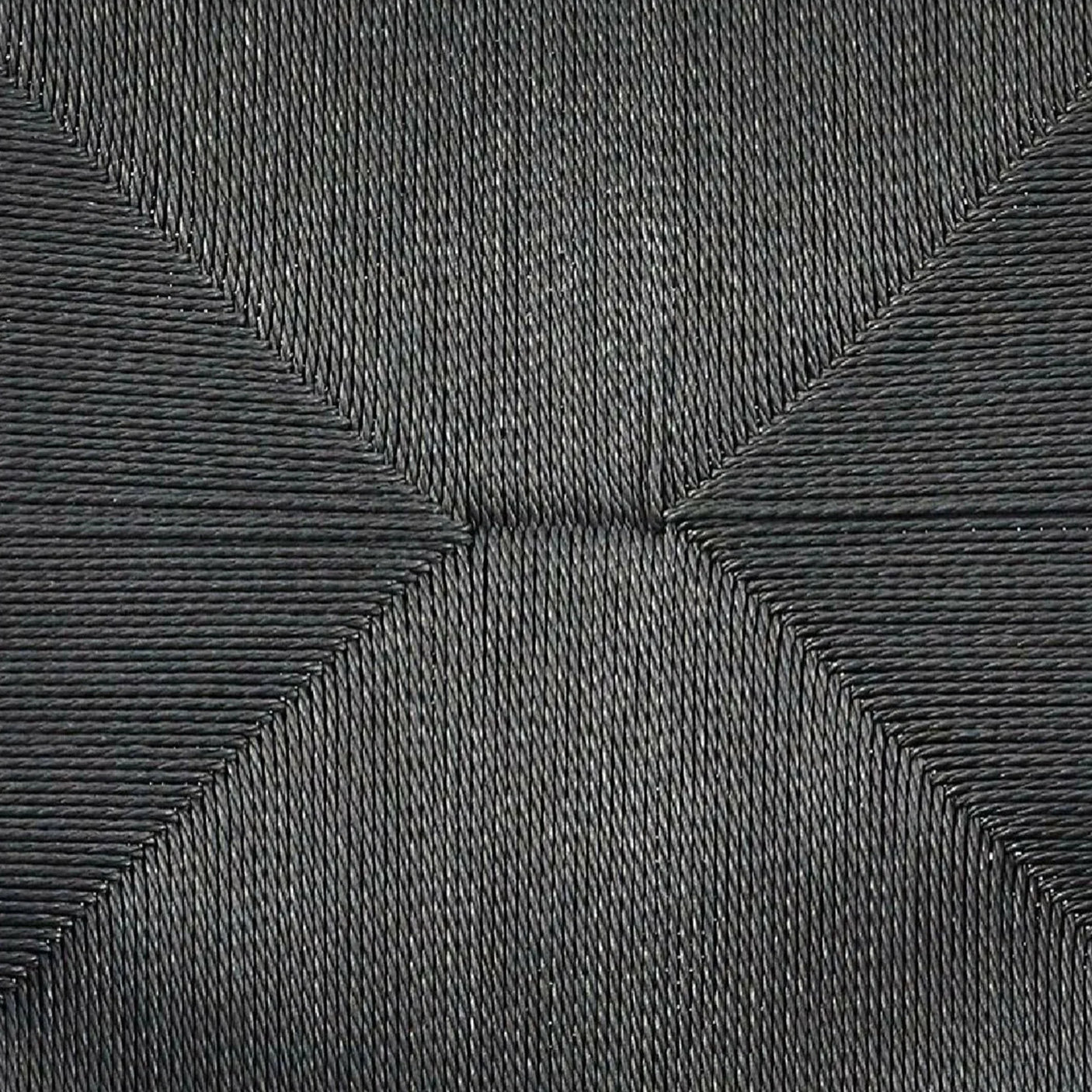 Black woven seat detail showing close-up of synthetic rattan chair texture