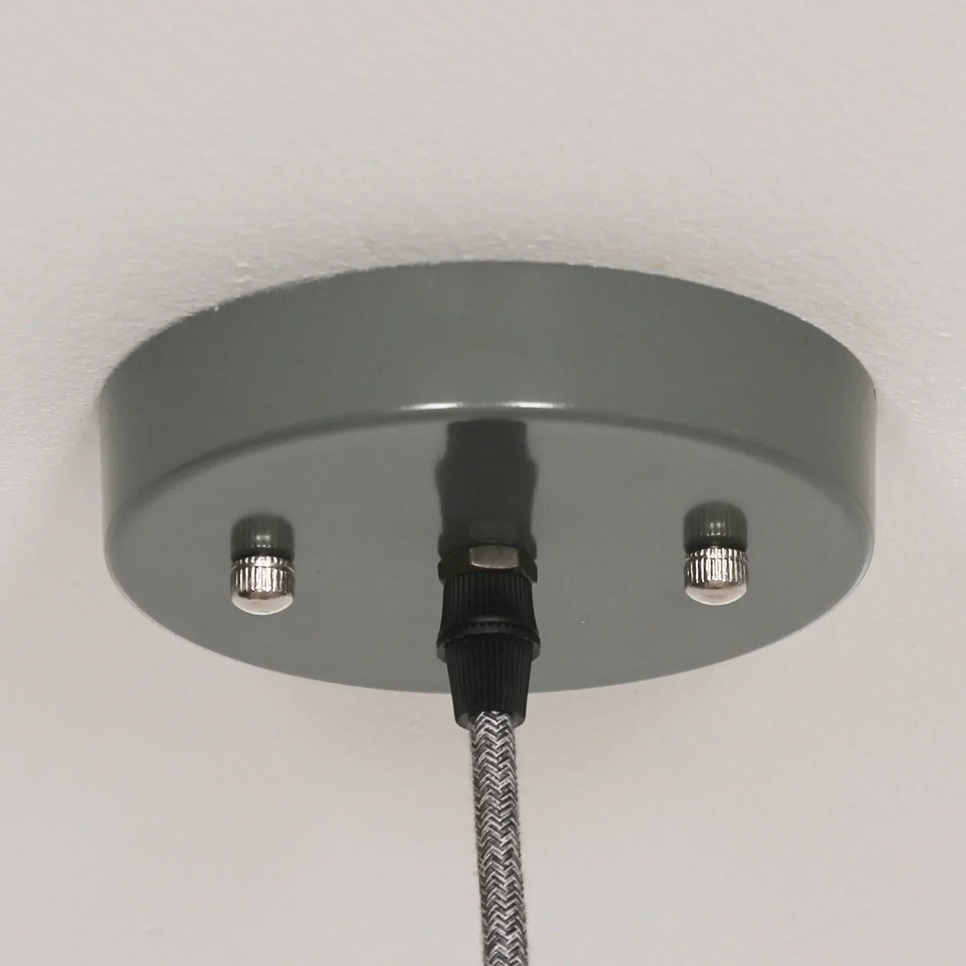 Grey ceiling light pendant cable with silver screws and fabric cord detail