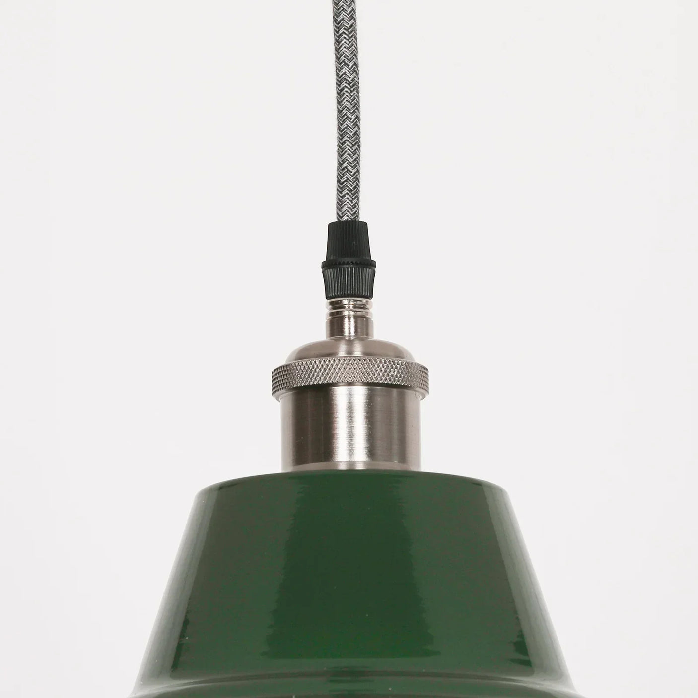 Green metal pendant light with silver fitting and braided cable, close detail view